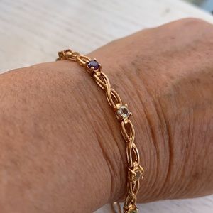 Goldtone bracelet with multicolored stones